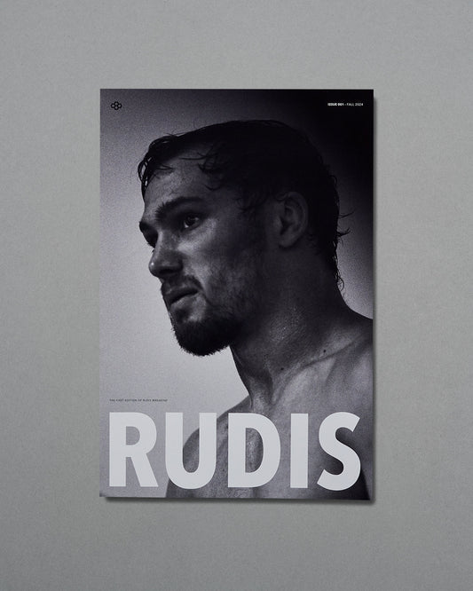 Poster of a shirtless man with 'RUDIS' text on a gray background