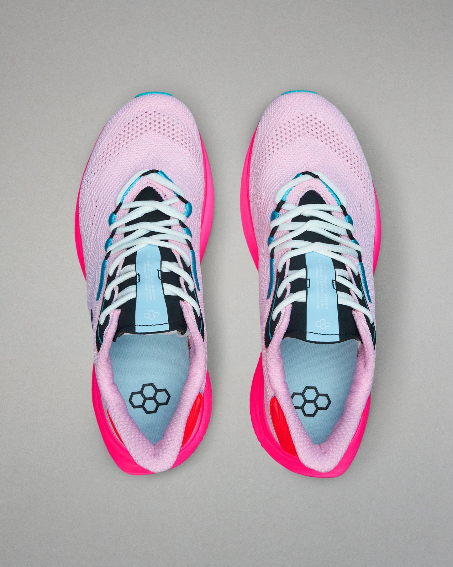 Pair of pink and black running shoes with blue accents on a gray background