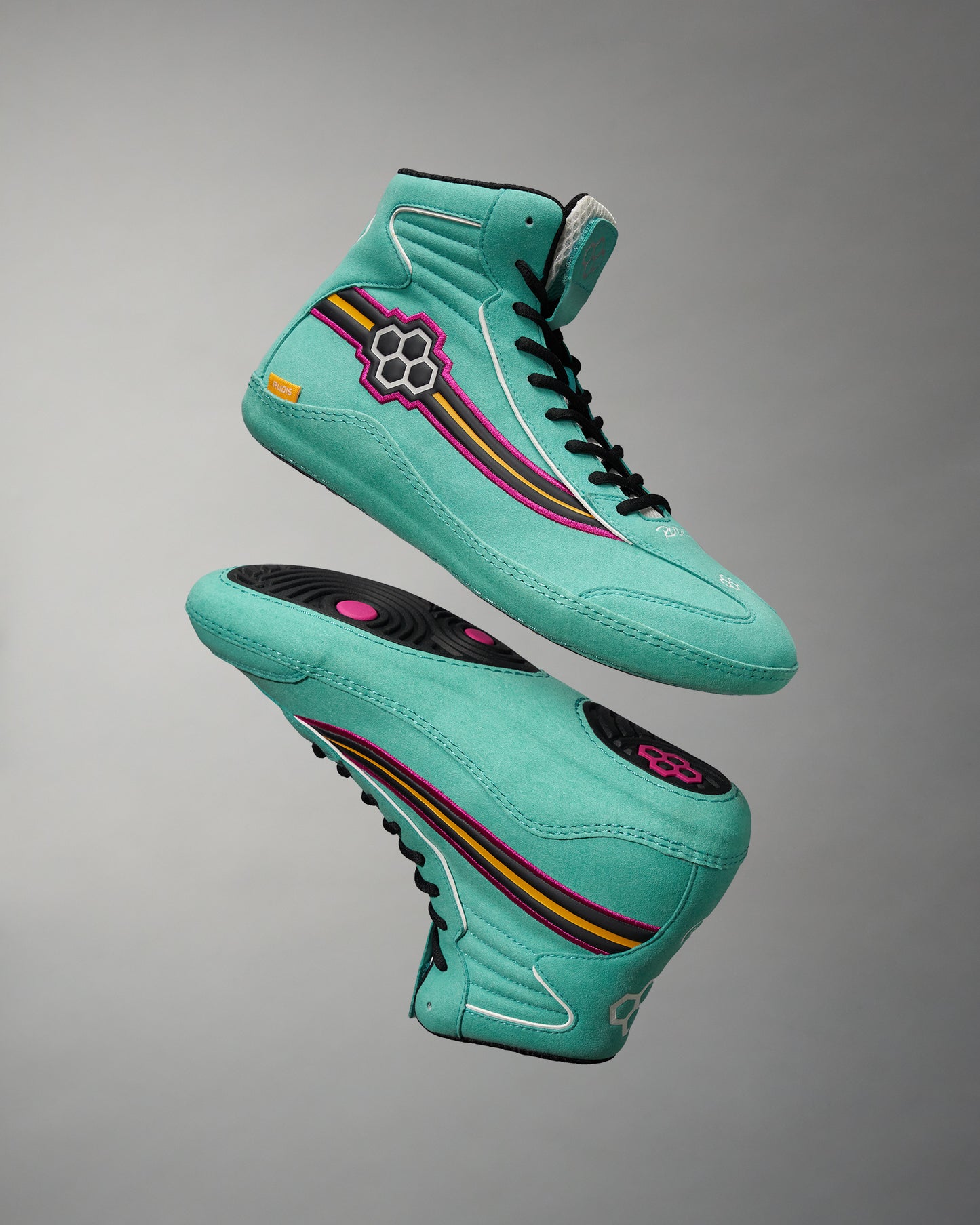 A pair of vibrant teal high-top sneakers featuring unique multicolored stripes and a distinctive logo design