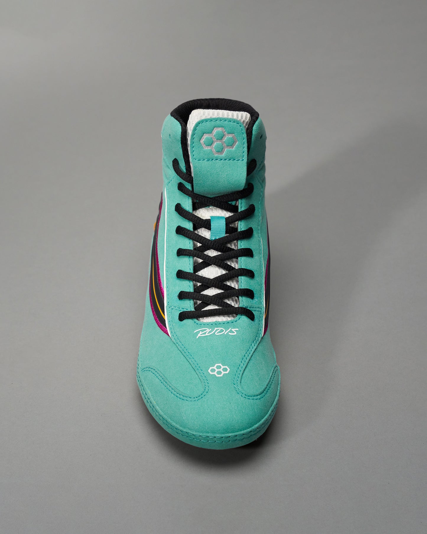 A vibrant turquoise wrestling shoe with black laces and colorful accents designed for optimal performance in the sport