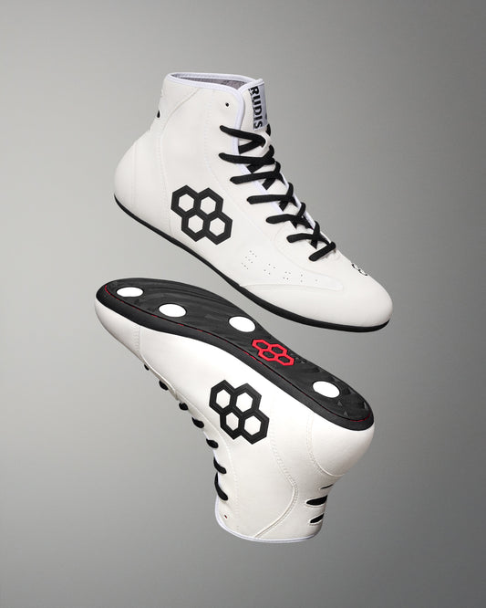 White wrestling shoes with black accents on a gray background