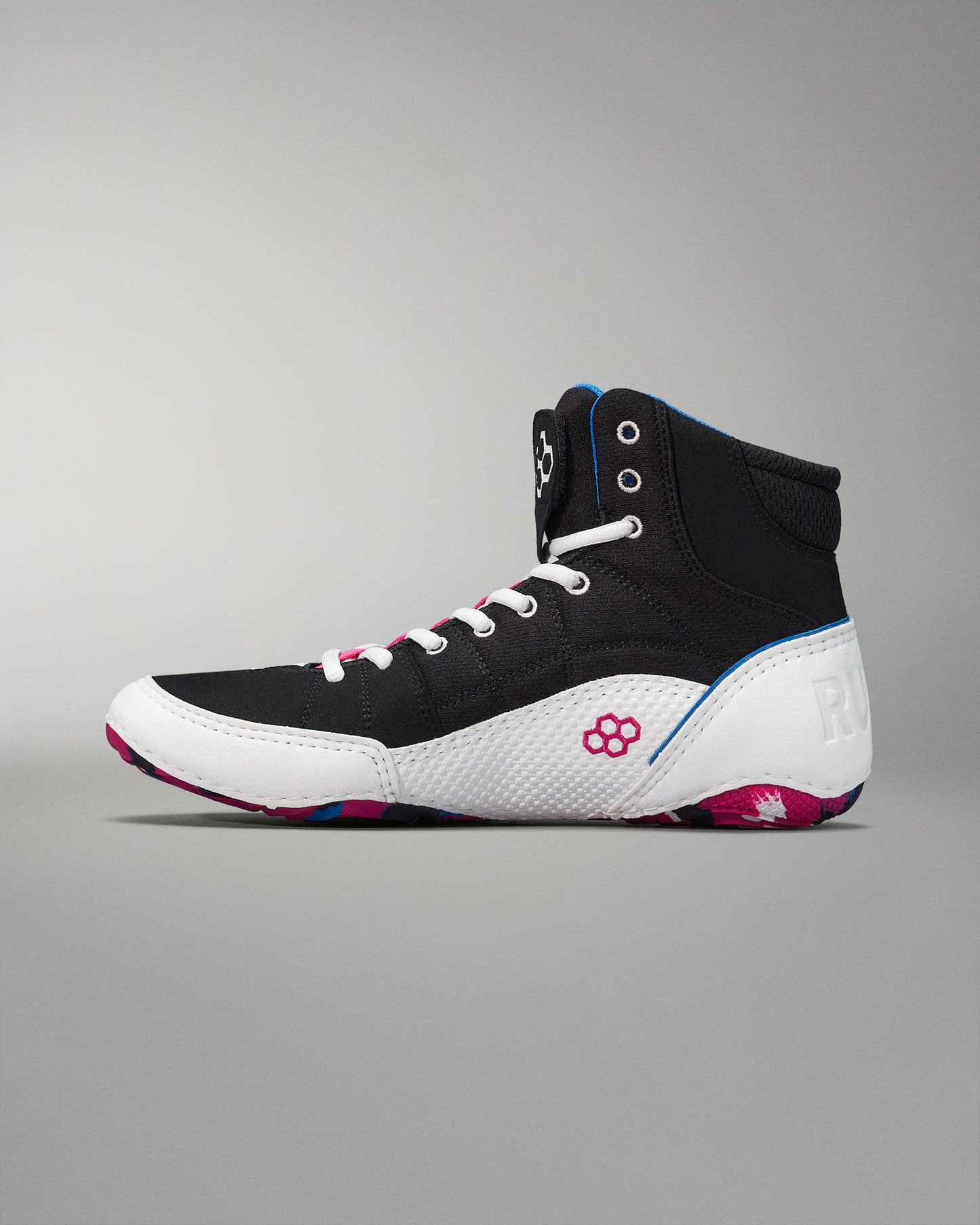High-top athletic shoe showcasing a black upper with a padded collar, white sole, and colorful pink and blue accents, designed for performance and style.