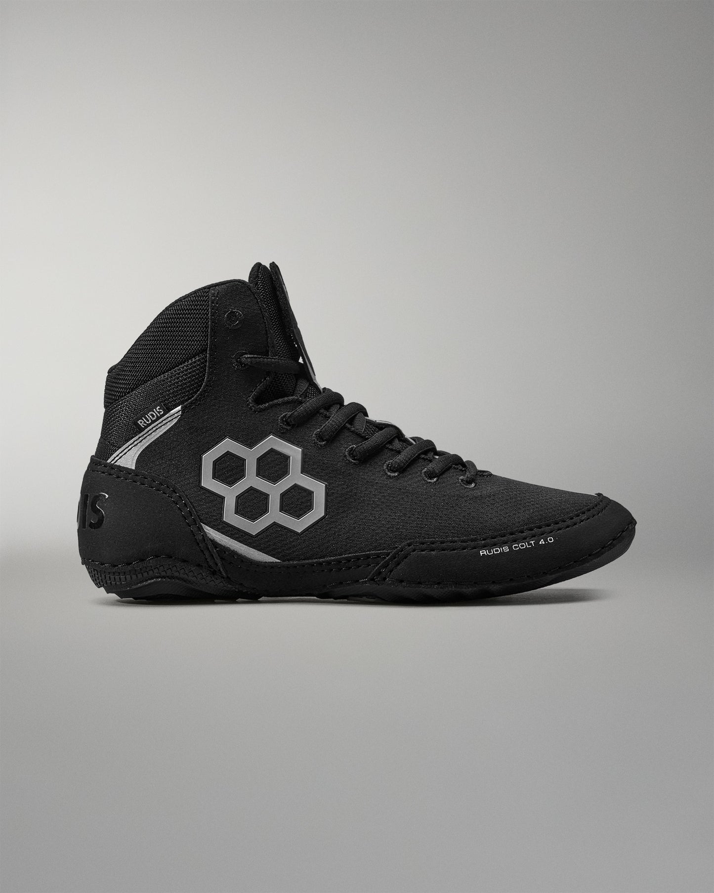 Black Wrestling shoe with a white logo on a gray background