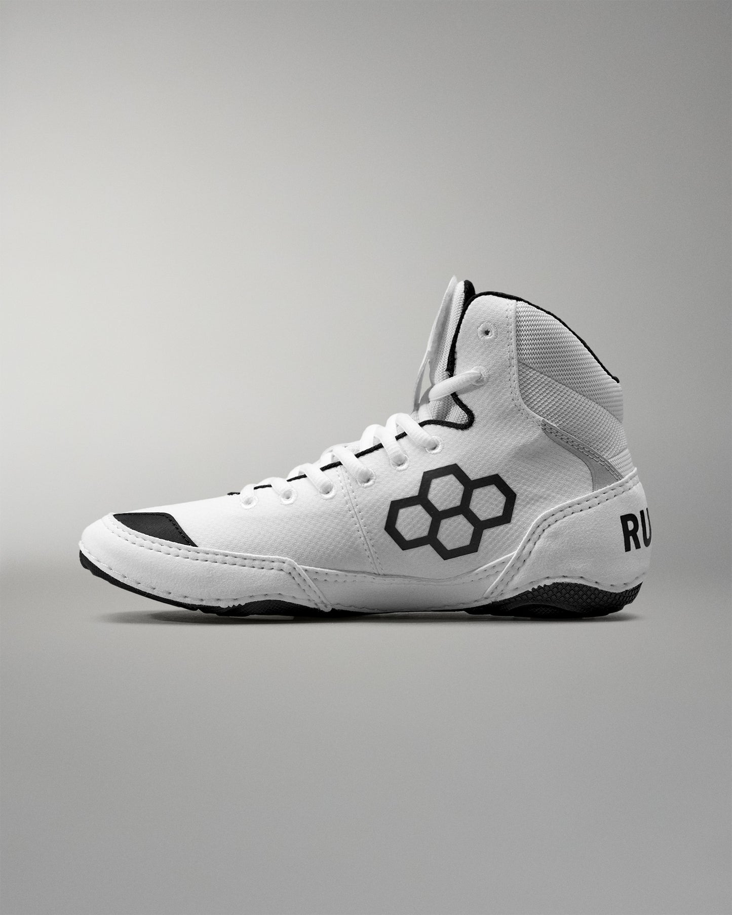 White Wrestling shoe with black accents on a gray background