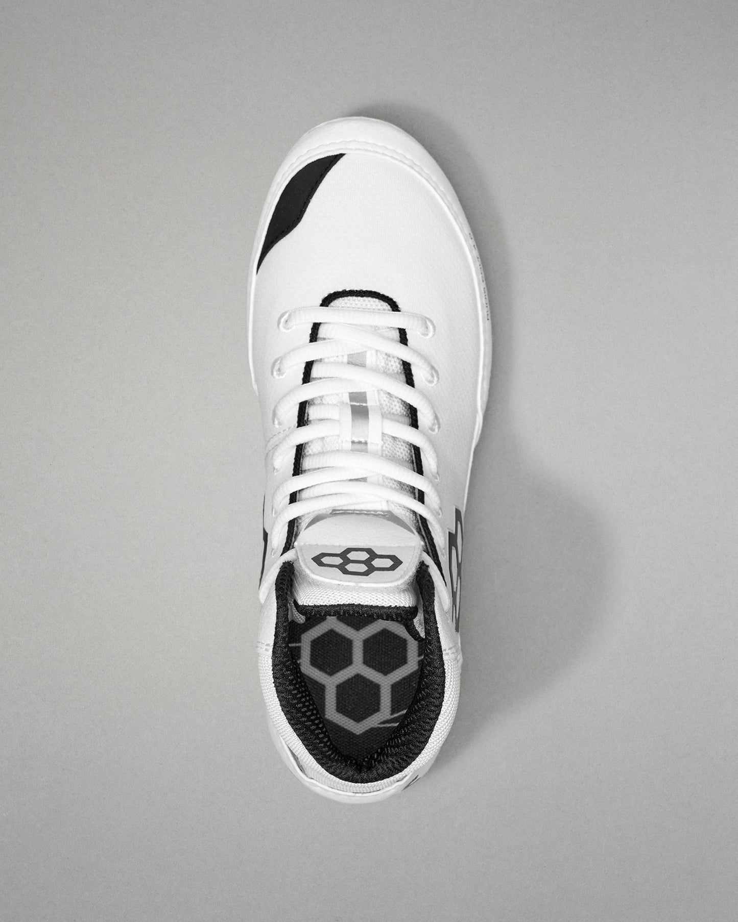 White Wrestling shoe with black sole on a gray background