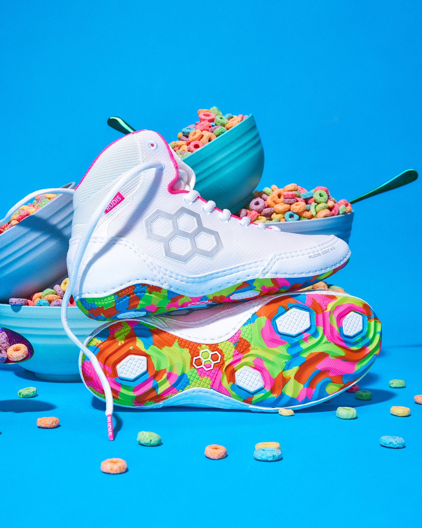 Colorful wrestling shoes with cereal-themed design on a blue background