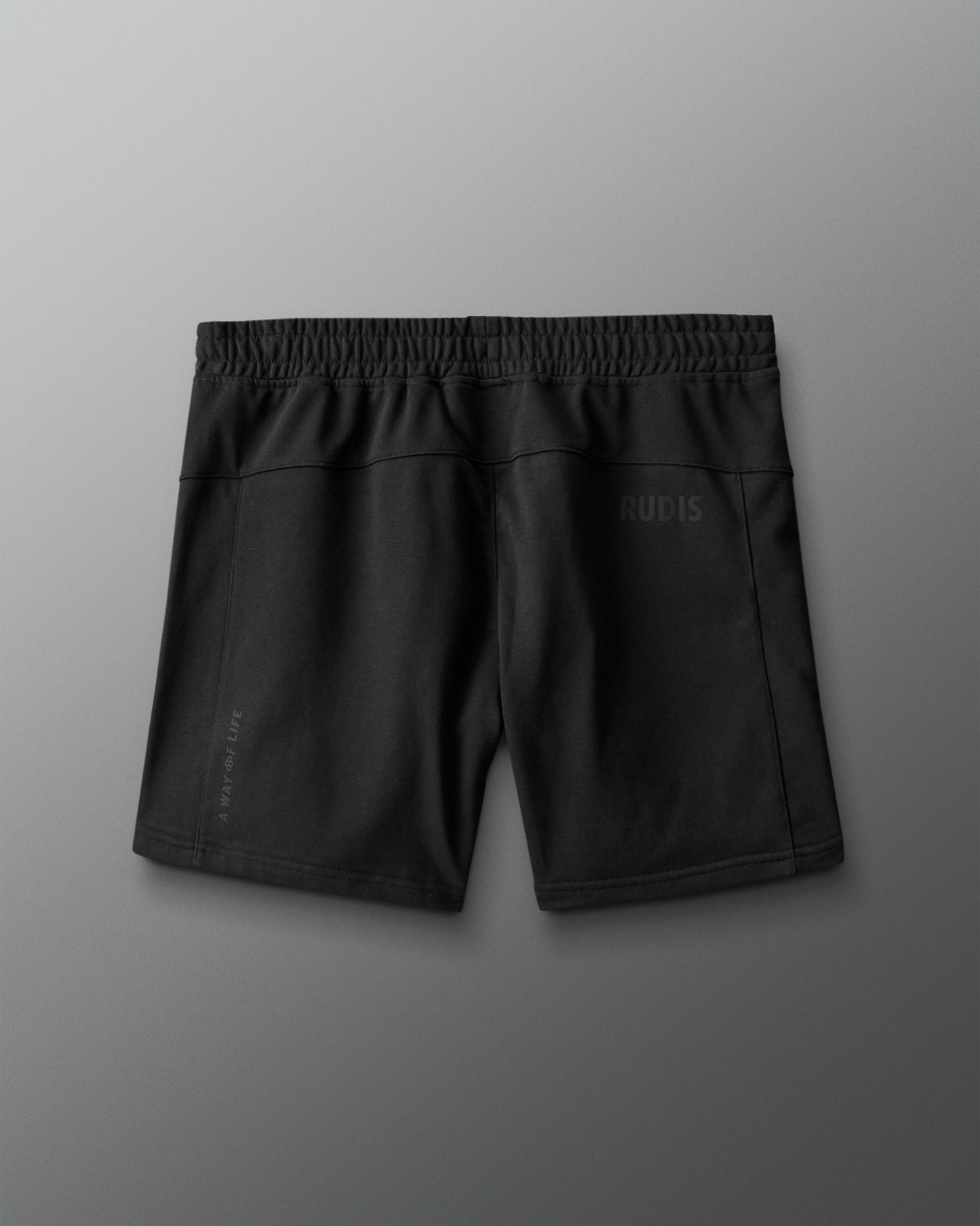 Black shorts with a brand logo on a gray background