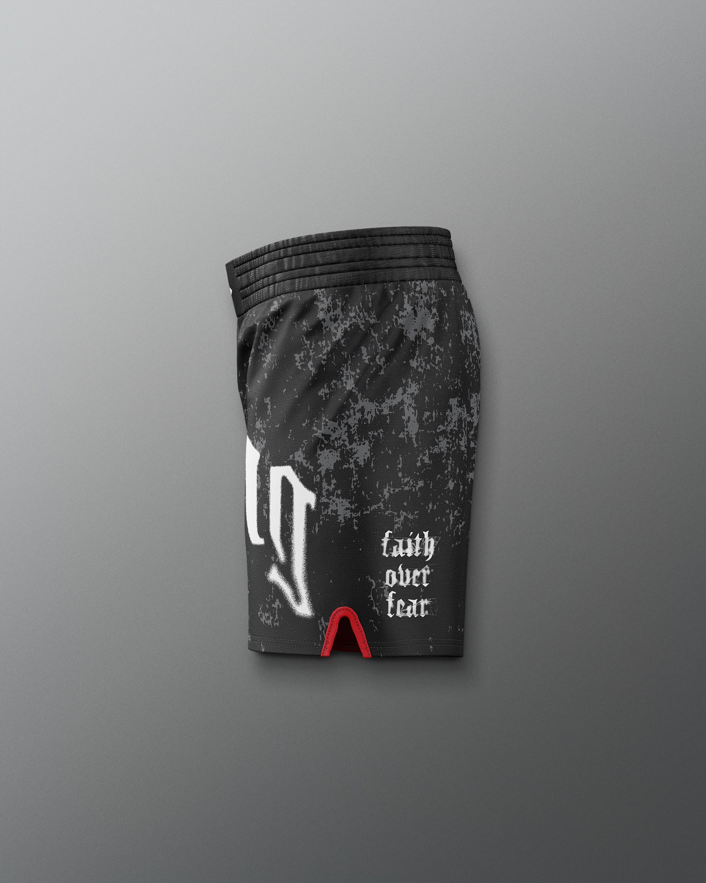 Black athletic shorts with 'faith over fear' text on a gray background