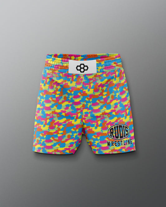 Colorful camouflage wrestling shorts with a brand label on a gray background