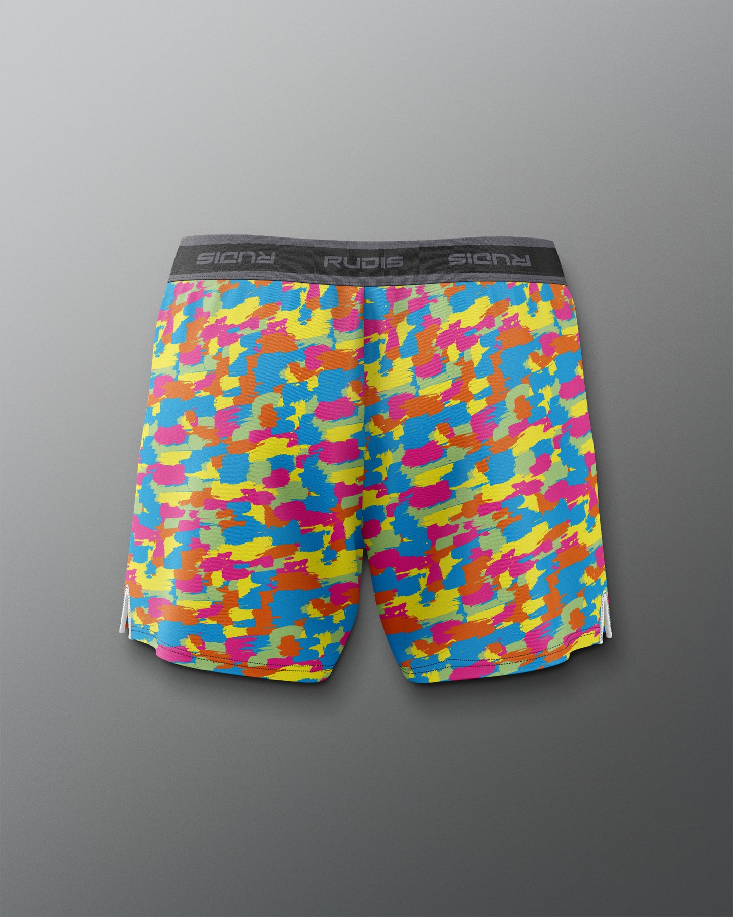 Colorful camouflage-patterned shorts on a gray background