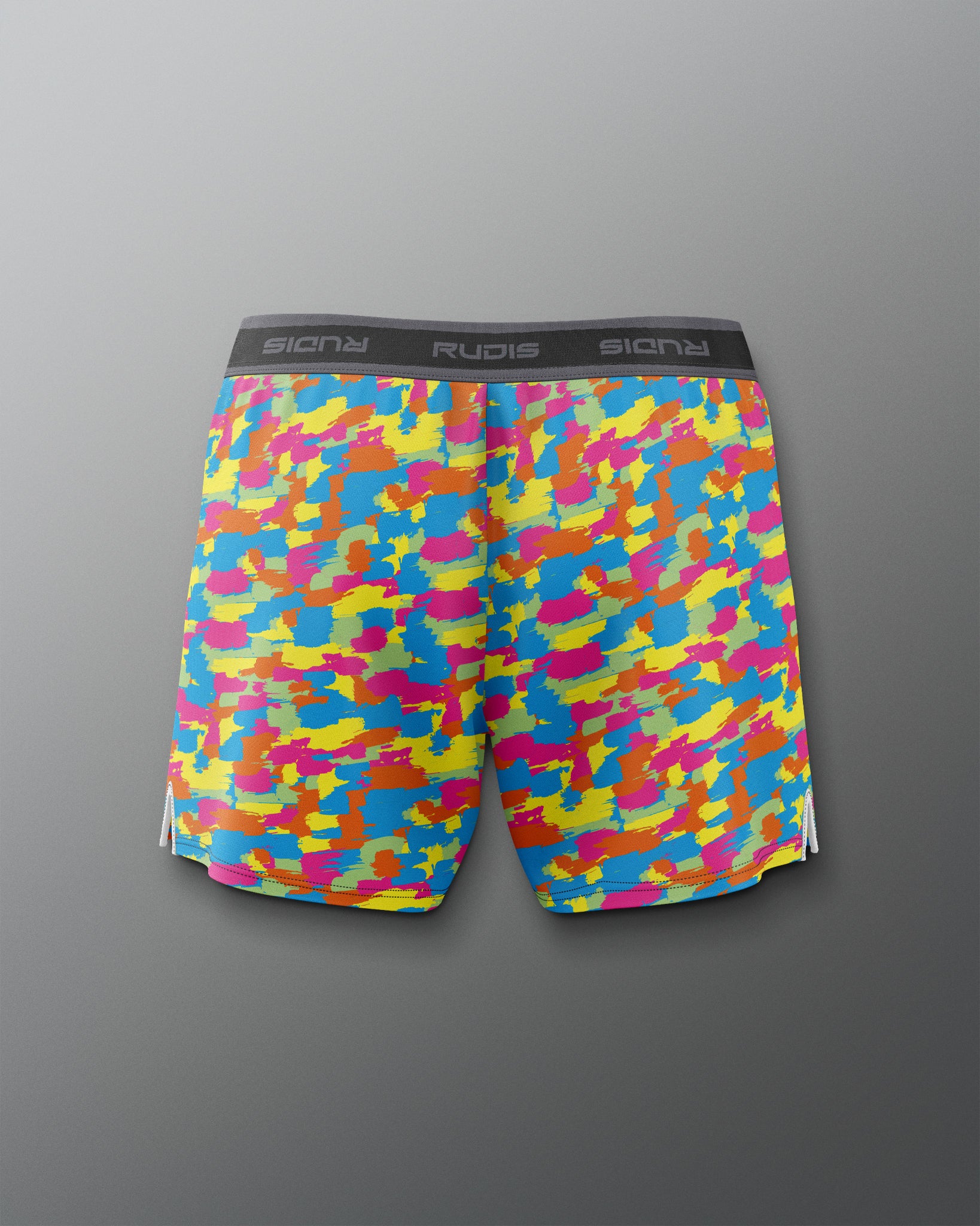 Colorful camouflage-patterned shorts on a gray background
