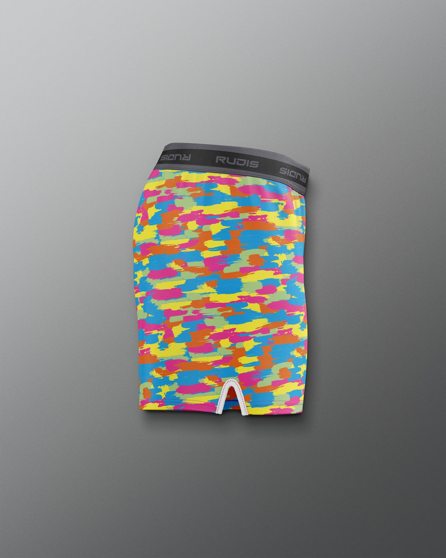 Colorful camouflage-patterned underwear on a gray background