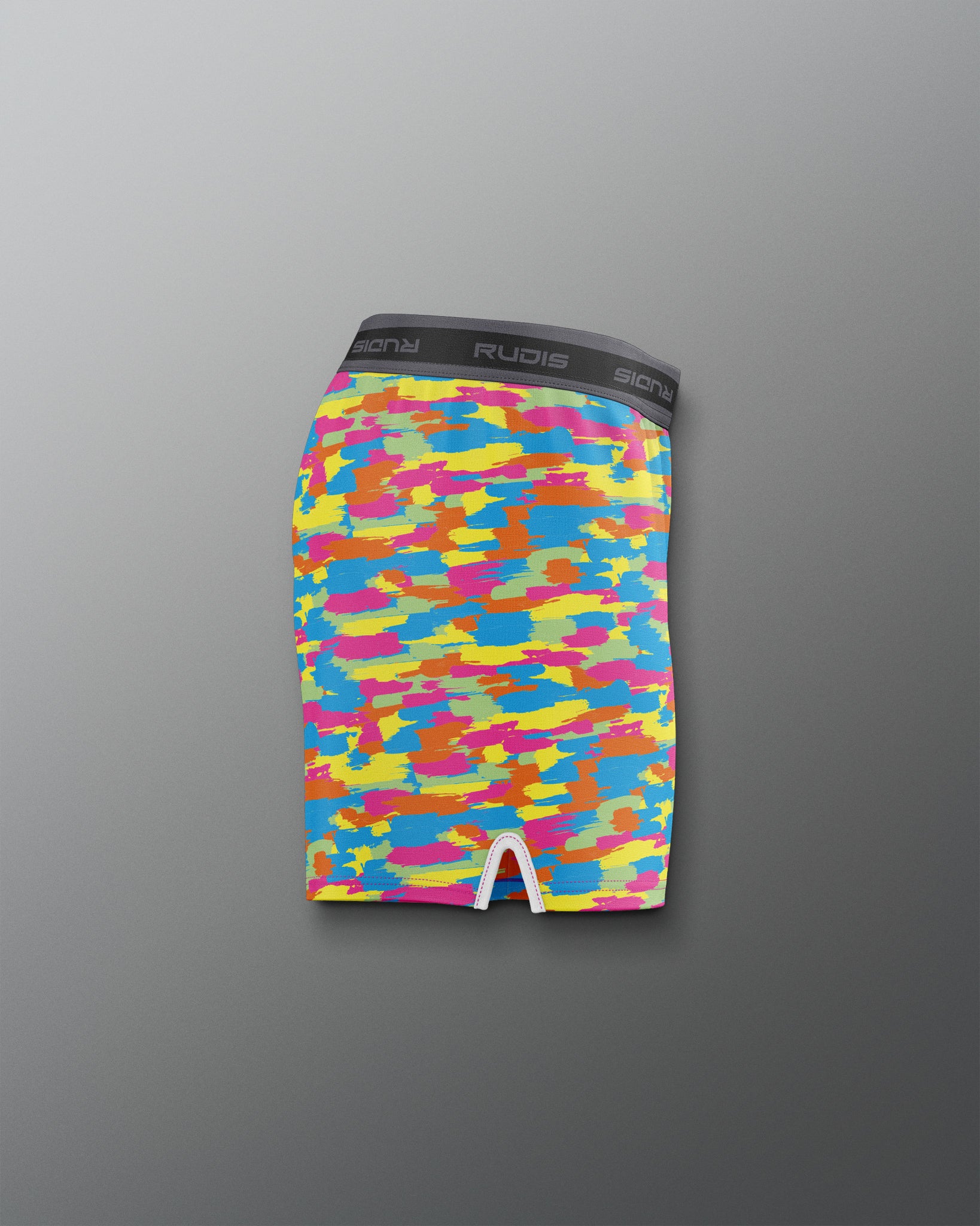 Colorful camouflage-patterned underwear on a gray background