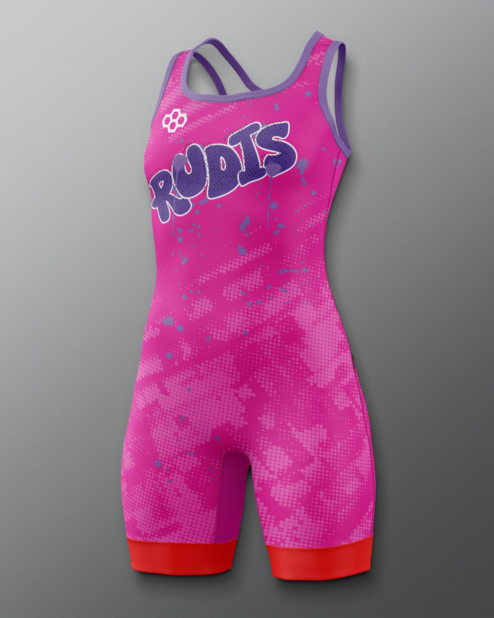 Front view of the RUDIS Strive Women’s Elite 2.0 Wrestling Singlet in pink with purple trim, featuring a bold RUDIS logo in graffiti style with light blue splatter accents and red leg cuffs