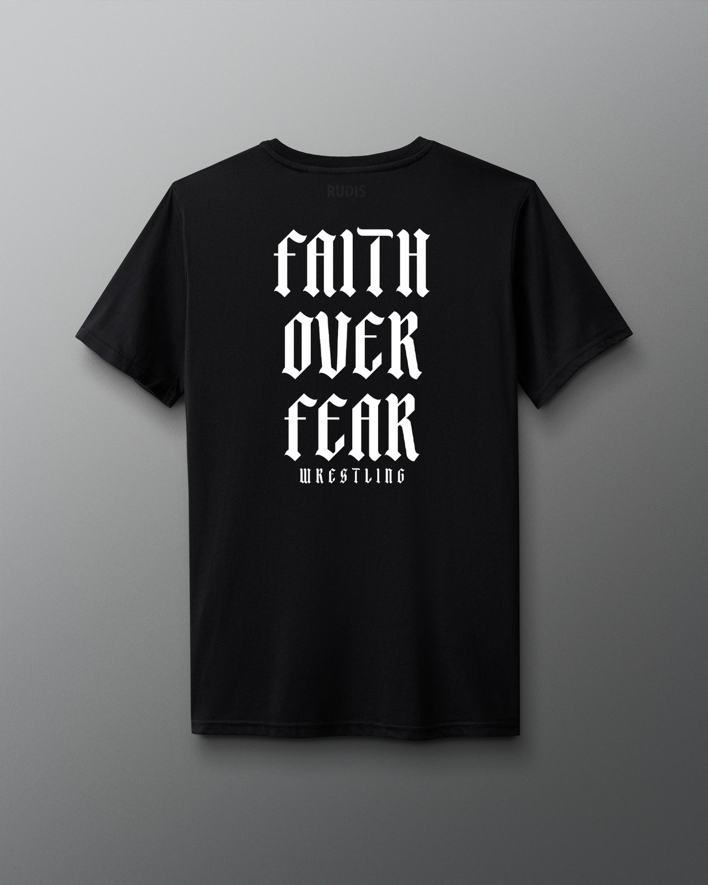 Back view of a black T-shirt featuring bold white gothic-style text that reads ‘Faith Over Fear Wrestling’ stacked vertically.