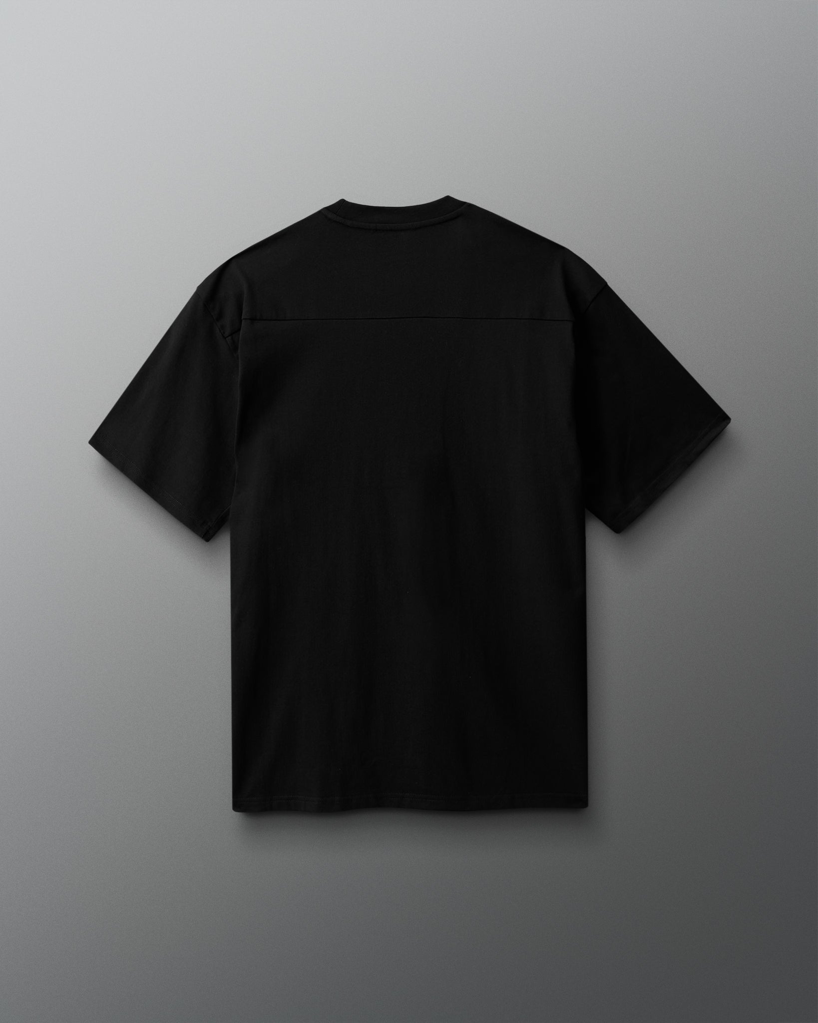 Black t-shirt on a gray background