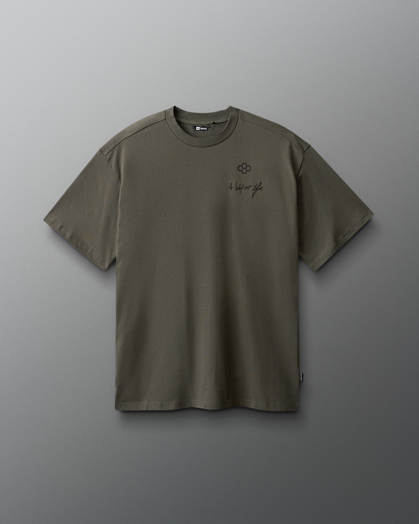 Green t-shirt with a small logo on a gray background