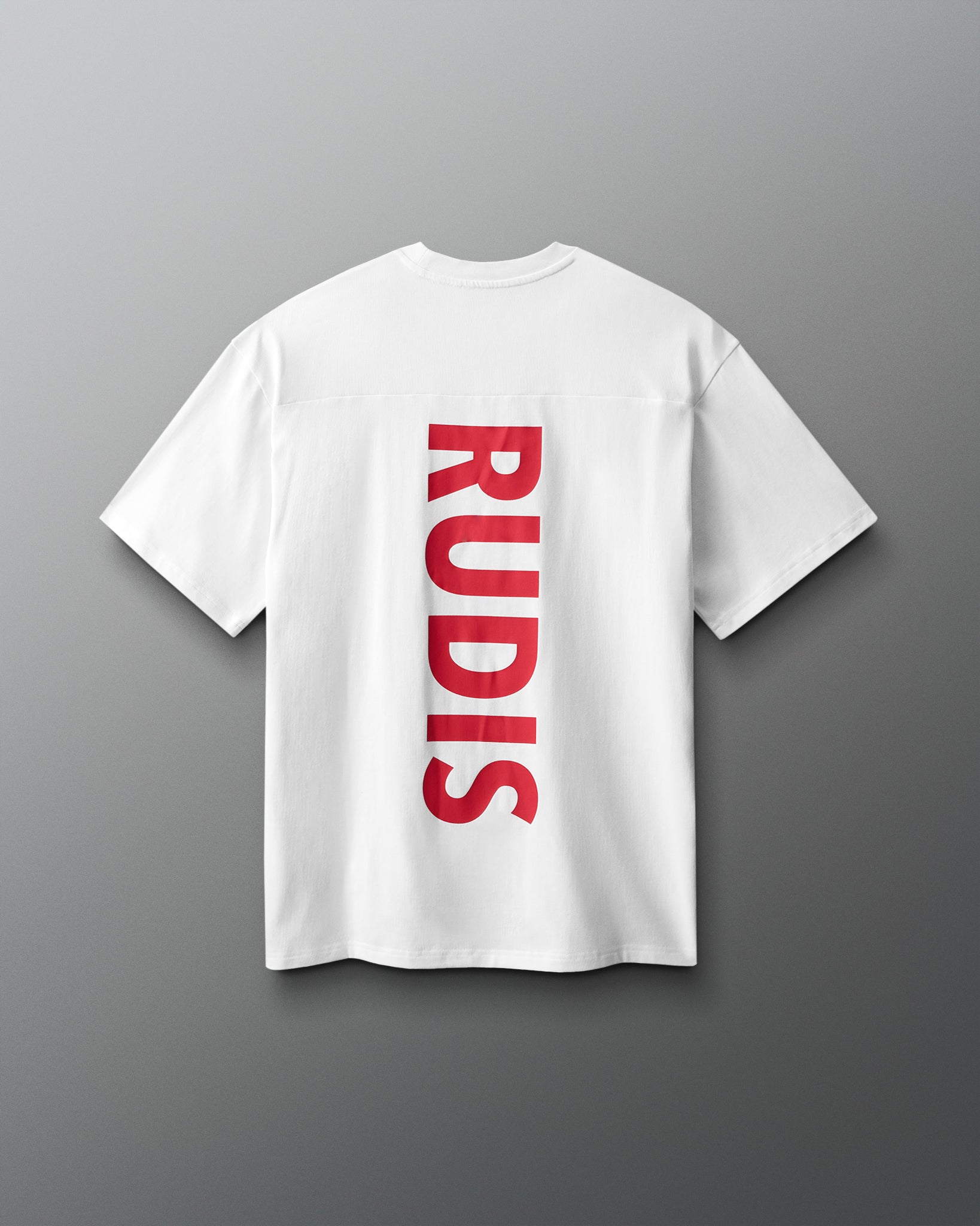 White t-shirt with red 'RUDIS' logo on a gray background
