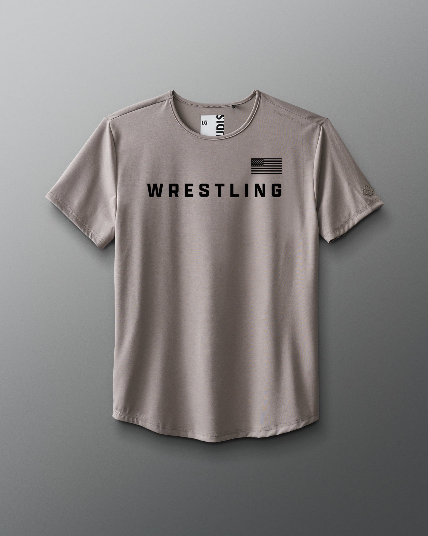 Beige t-shirt with 'Wrestling' text and American flag on a gray background