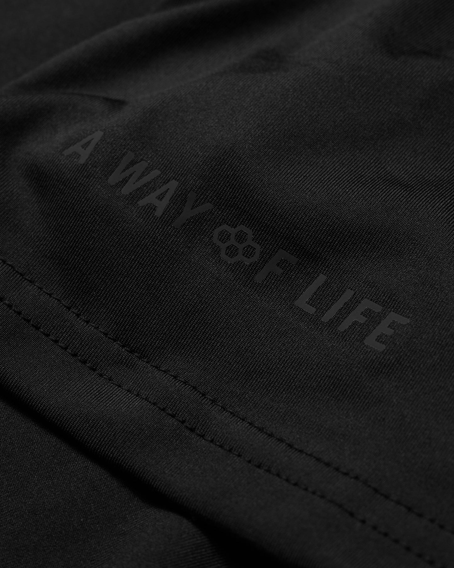 Black jacket with 'A Way of Life' logo on a dark background