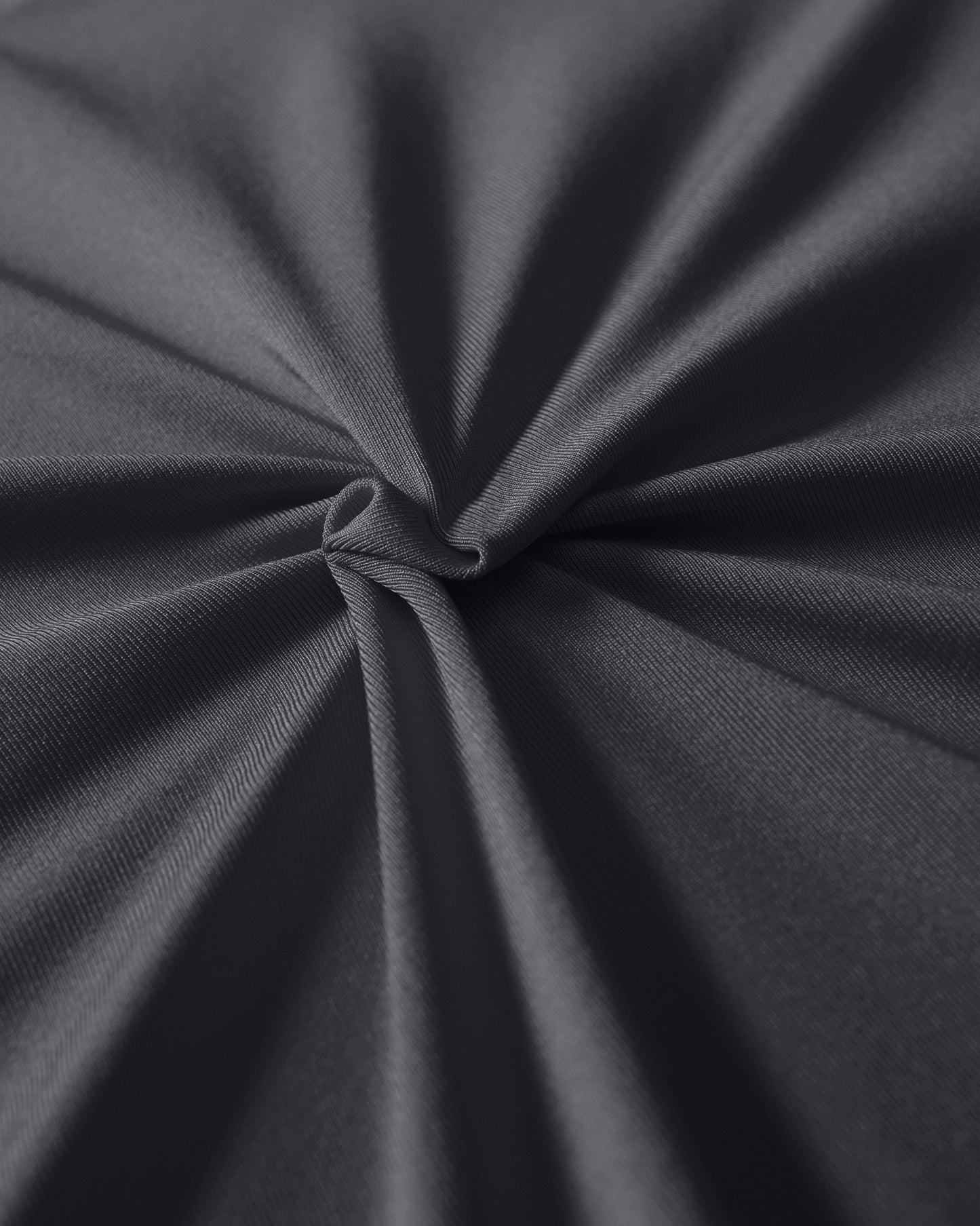 Close-up of dark gray fabric with a knot