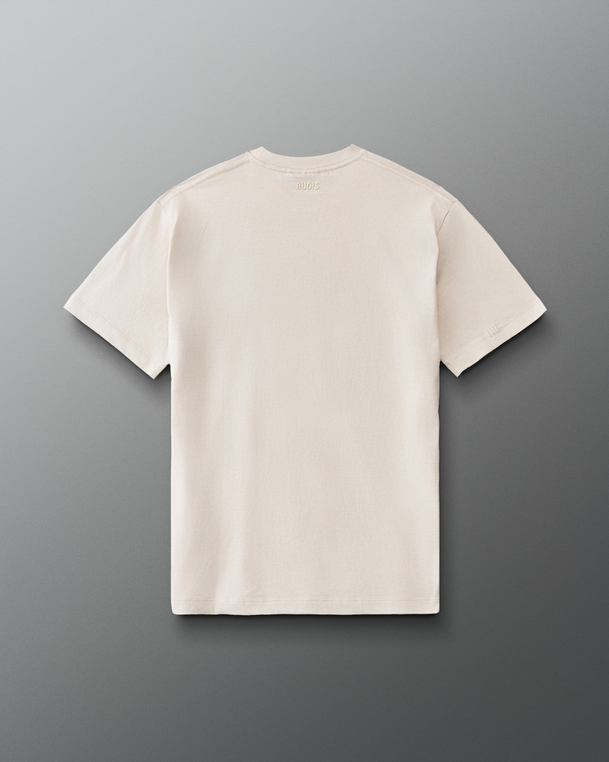 Back view of RUDIS Hex Classic Cotton T-Shirt in Bone with a plain back design and subtle tonal RUDIS branding below the collar.