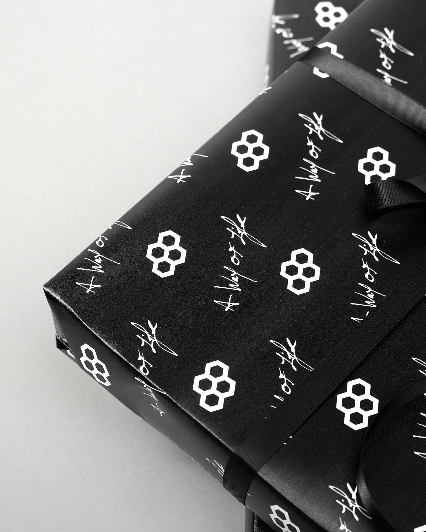 Black fabric with white geometric patterns on a light gray background