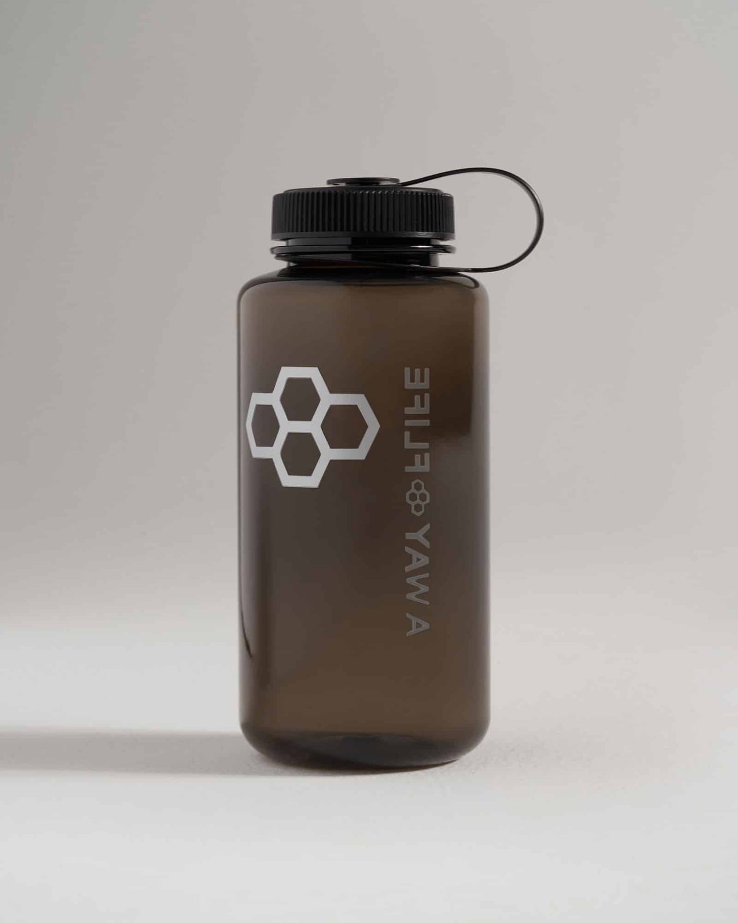 A sleek dark amber water bottle featuring a honeycomb graphic and a secure lid designed for style and functionality