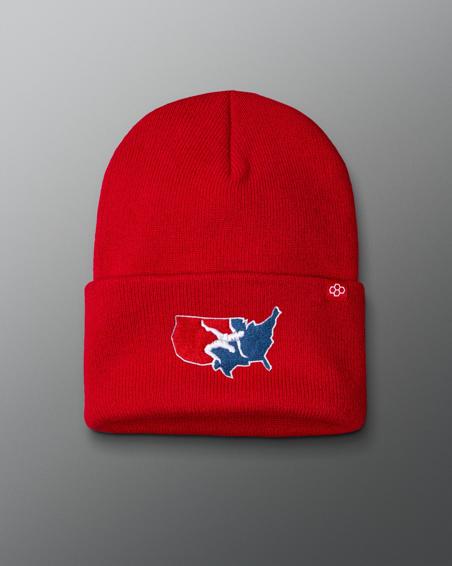 A red foldover beanie with a logo of the United States of America on the front.