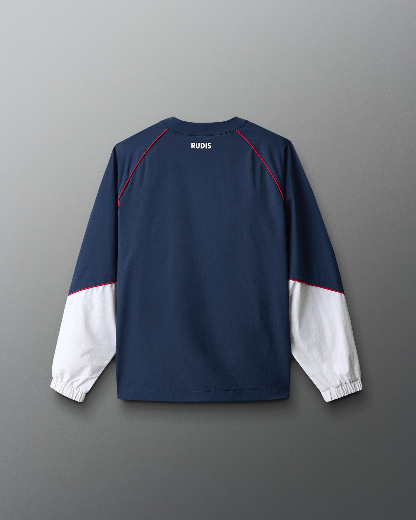 Navy and white long-sleeve shirt with 'RUDIS' branding on a gray background