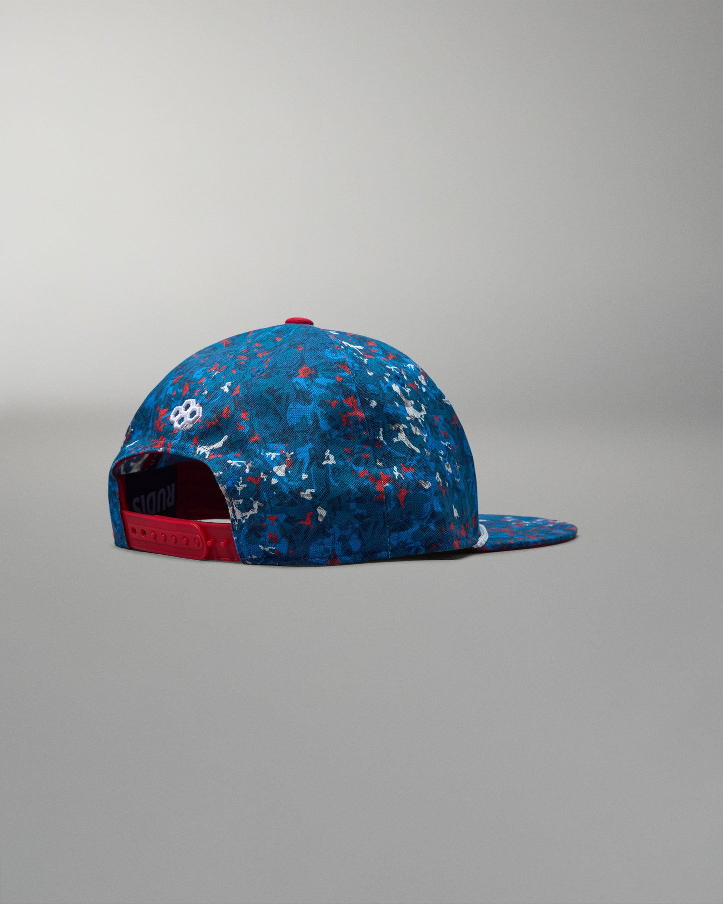 Blue and red patterned cap on a gray background