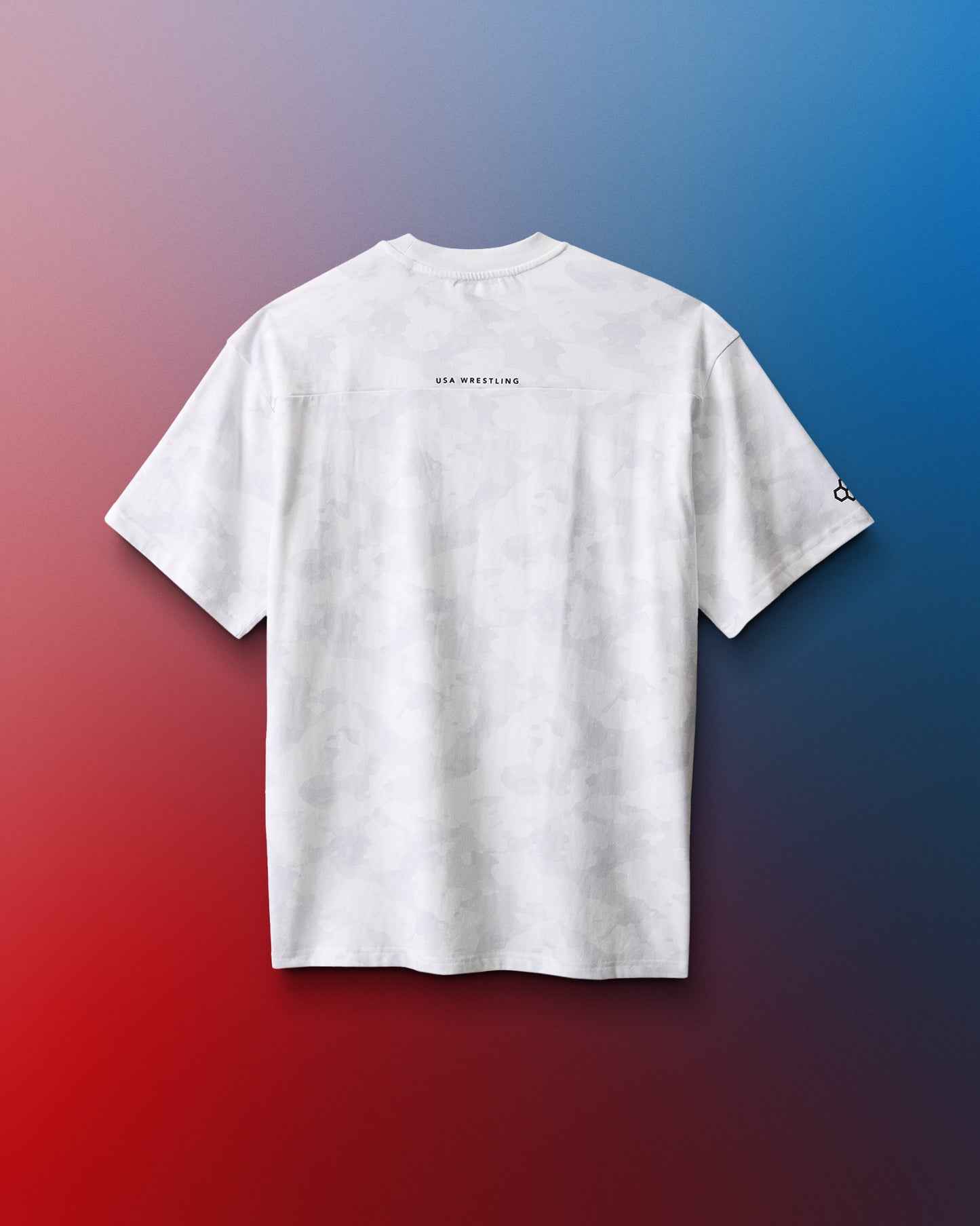 White t-shirt with text on the back against a gradient red to blue background