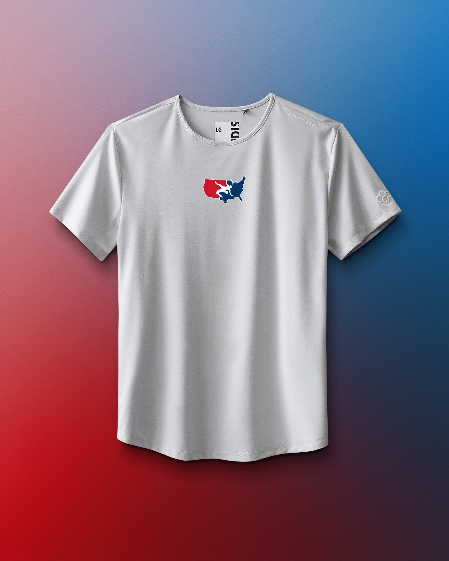 White t-shirt with a colorful logo on a gradient red and blue background