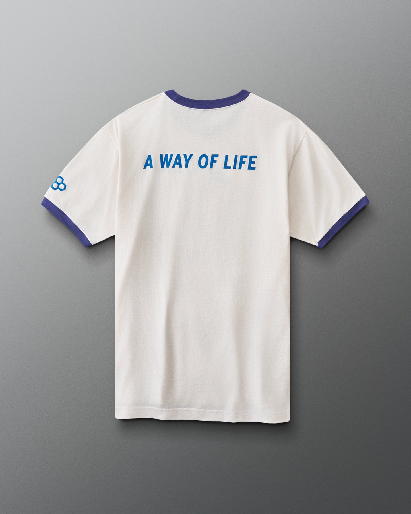 Back view of RUDIS USA Wrestling Ringer T-Shirt in vintage white with navy trim, blue “A Way of Life” graphic, and RUDIS sleeve logo.