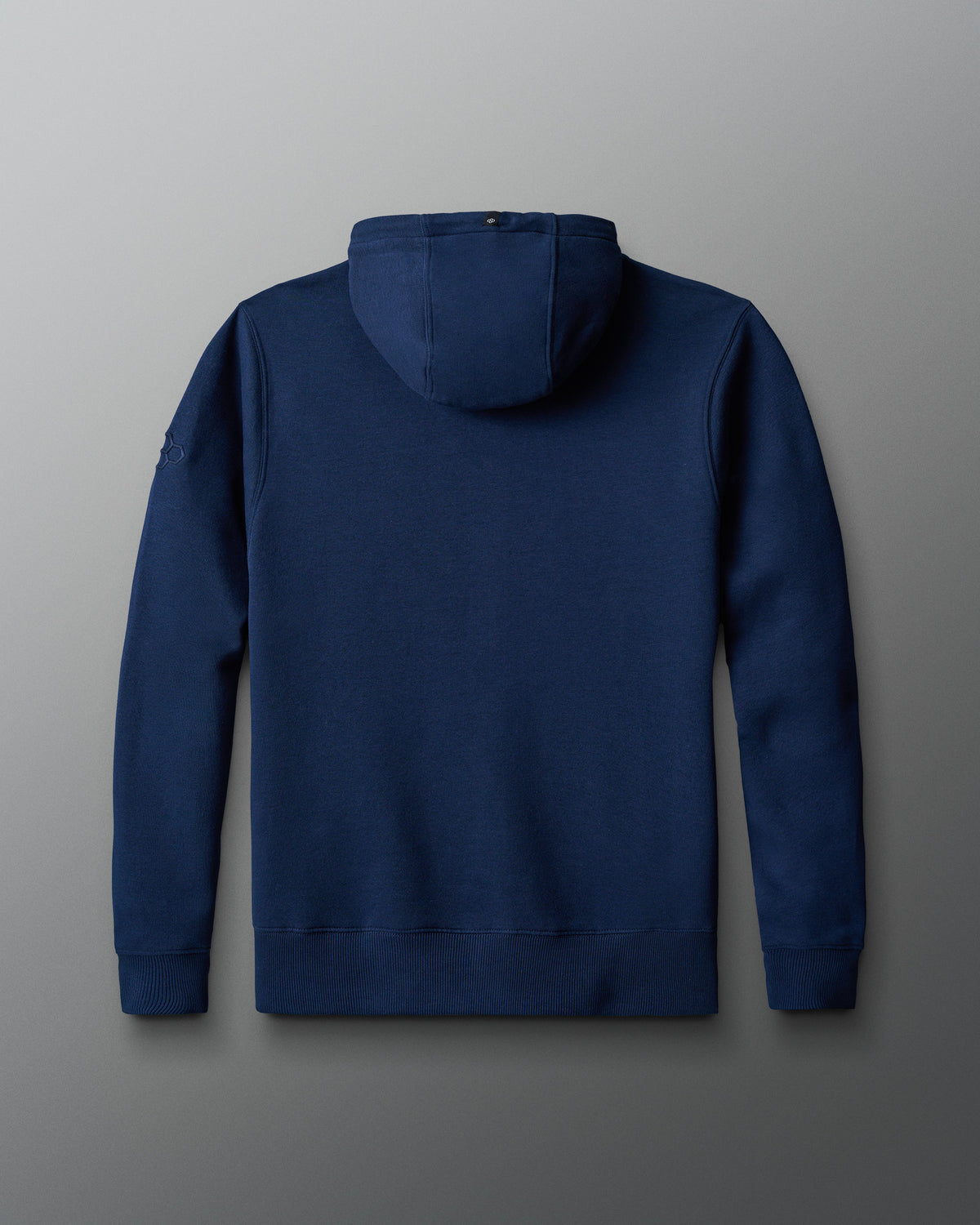 Back view of the navy RUDIS UWW Full-Zip Comfort Fleece Hoodie, showcasing a clean, minimal finish with a structured hood, ribbed cuffs and hem, and subtle tonal RUDIS branding on the sleeve.