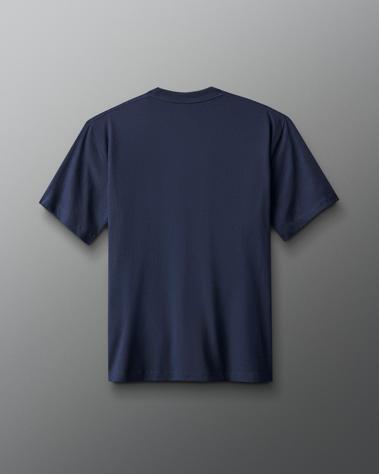 Navy blue t-shirt on a gray background