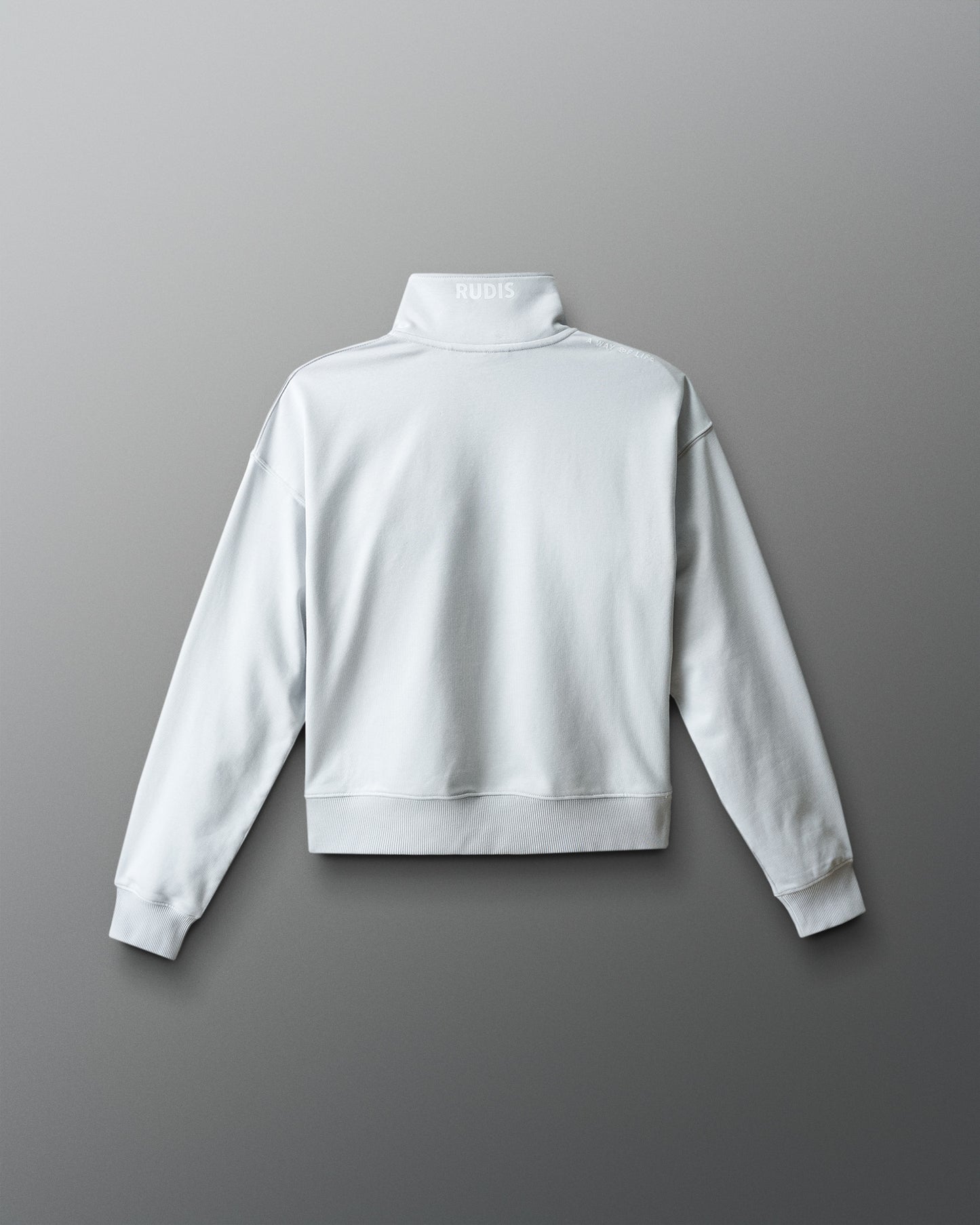 White sweatshirt on a gray background