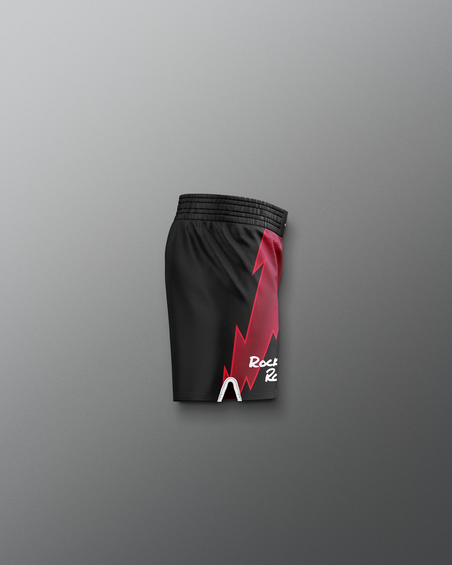 Black shorts with a red and white logo on a gray background