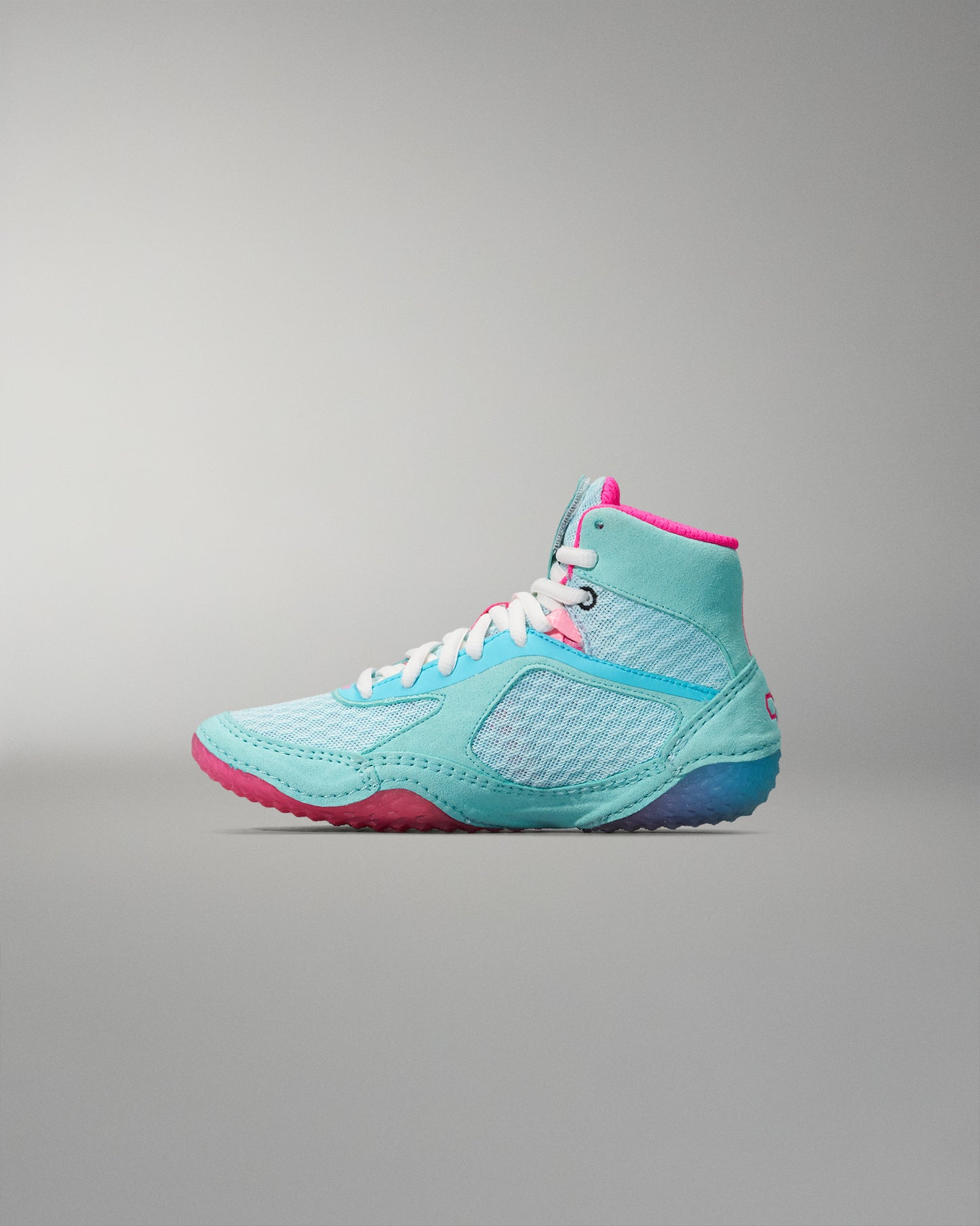 Turquoise and pink Wrestling Shoe on a gray background