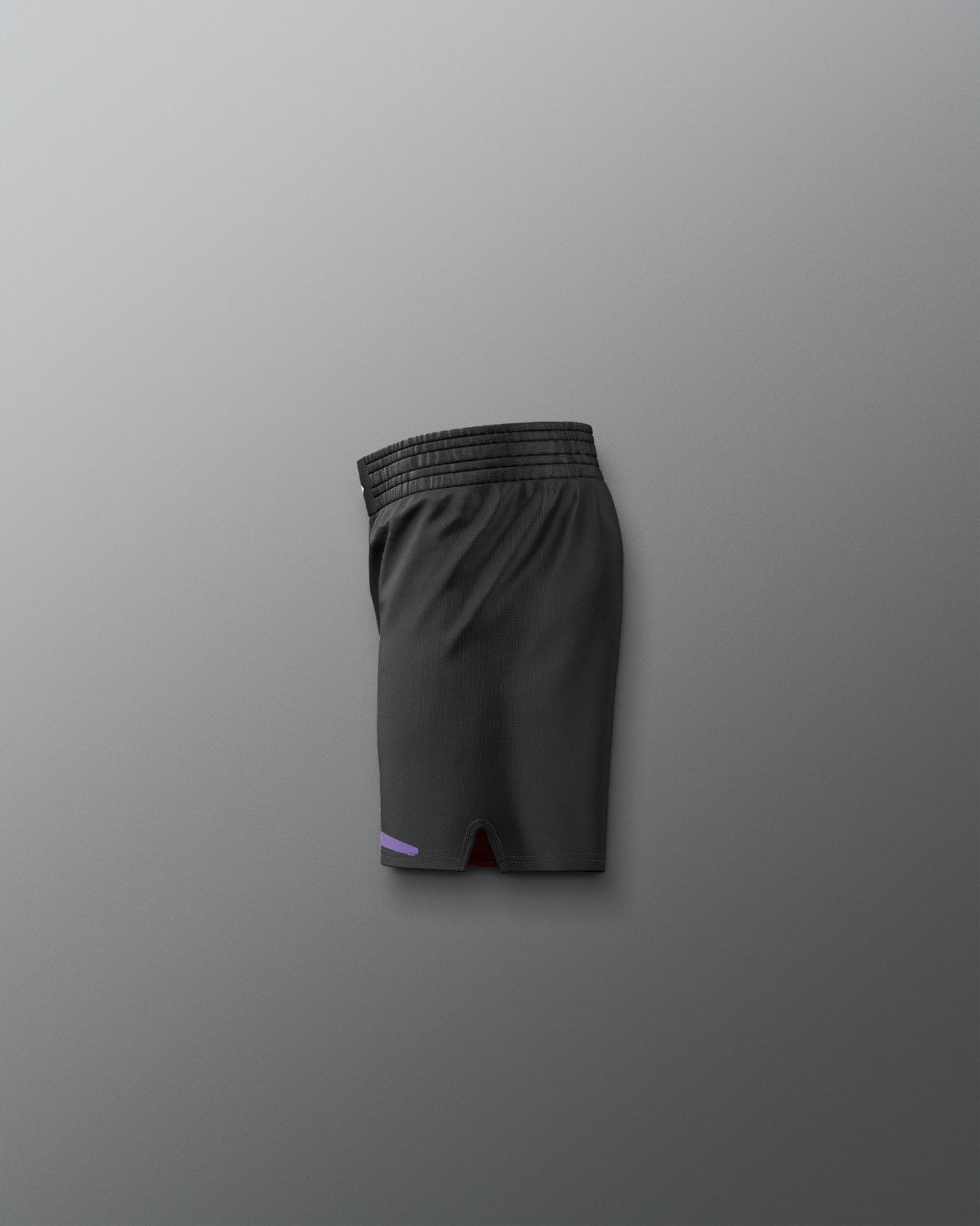 Black athletic shorts on a gray background