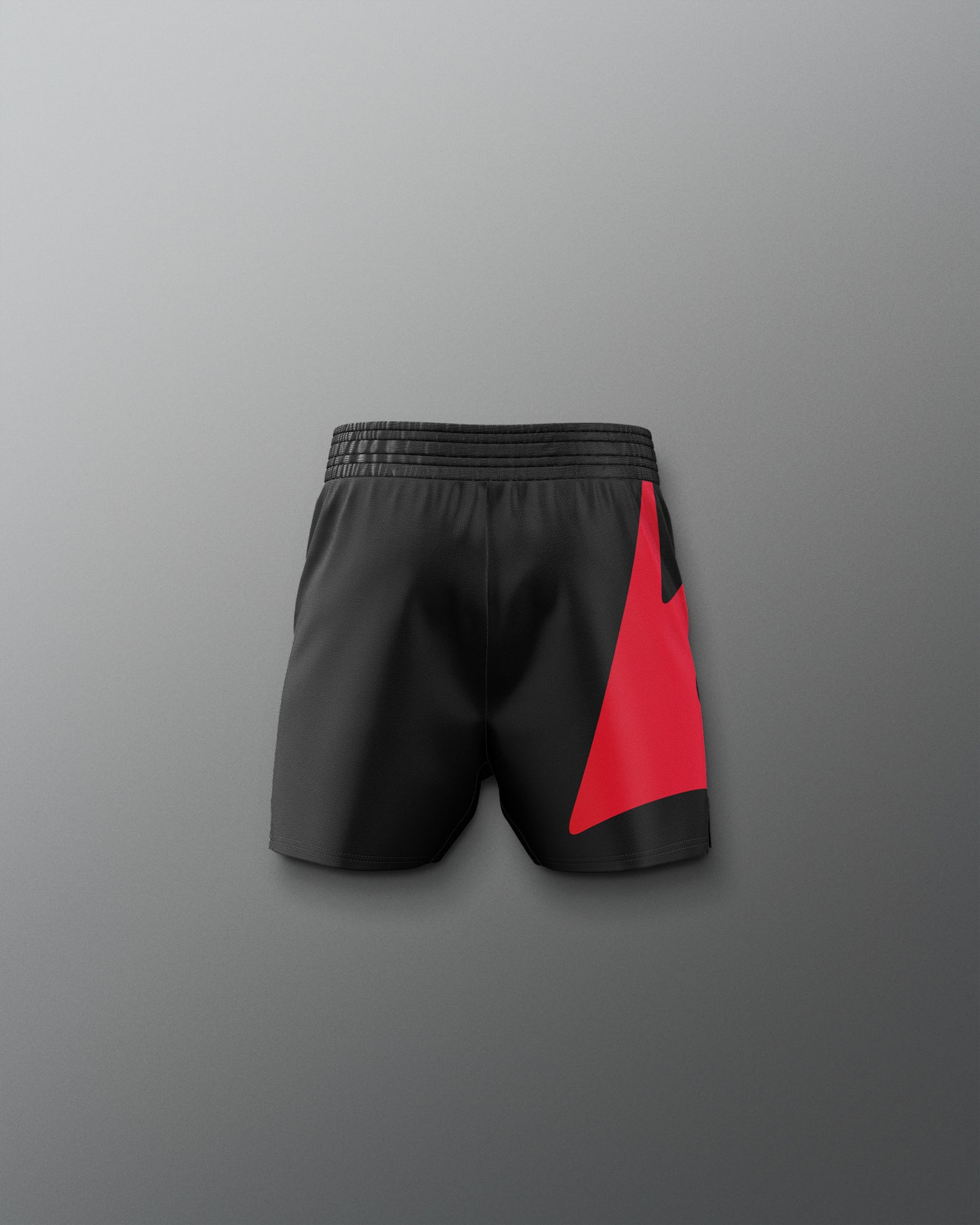 Black shorts with a red patch on a gray background