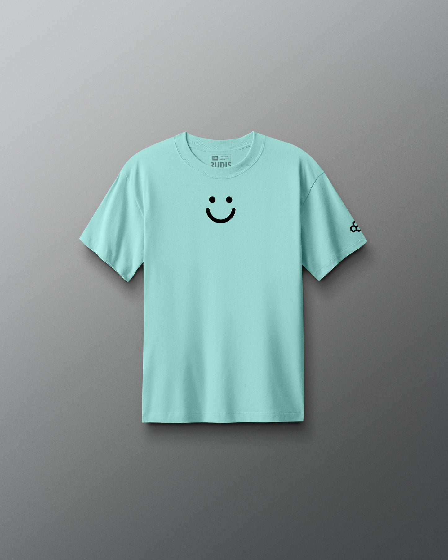 Light blue t-shirt with a smiley face design on a gray background