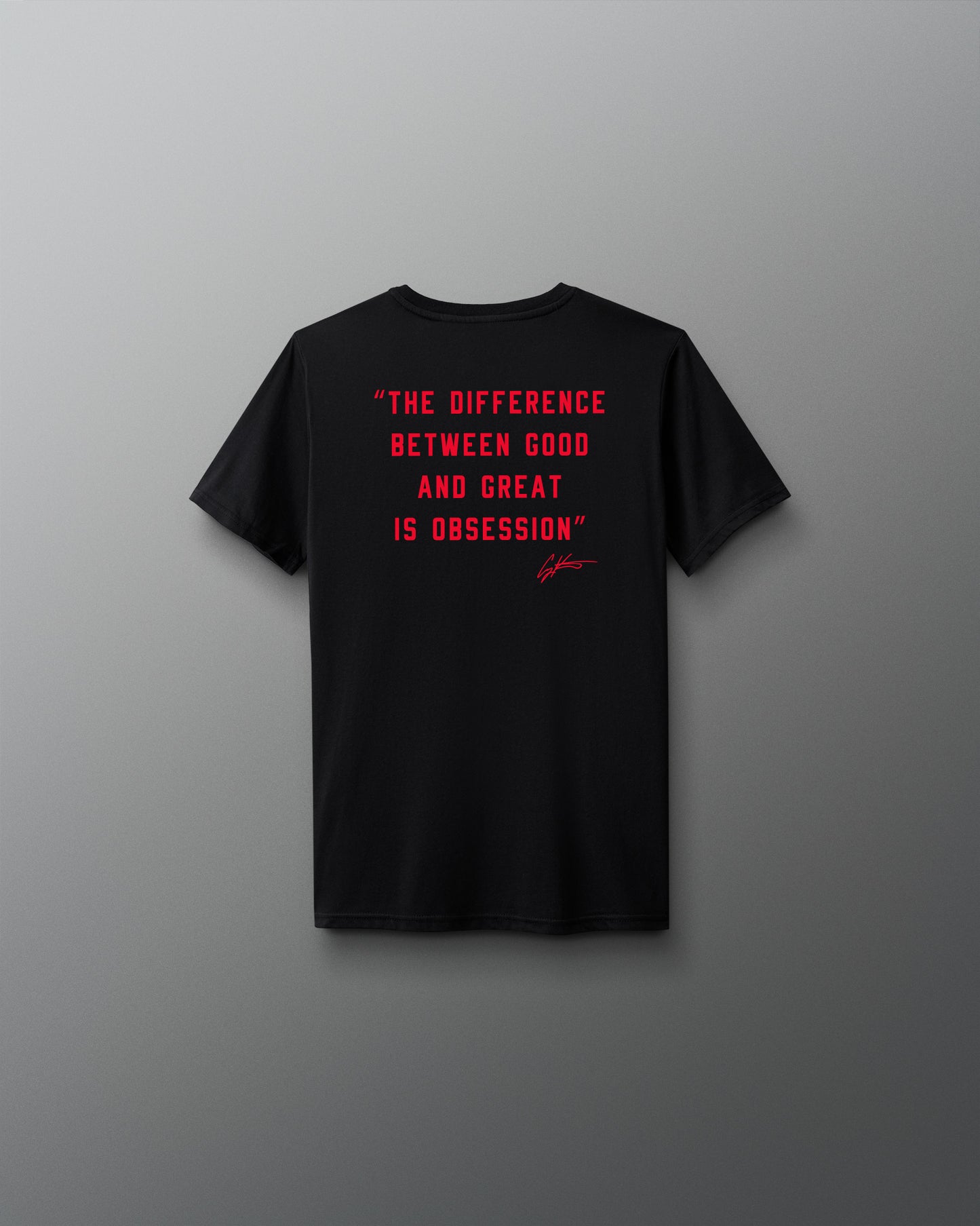Black t-shirt with red text 'The difference between good and great is obsession' on a gray background