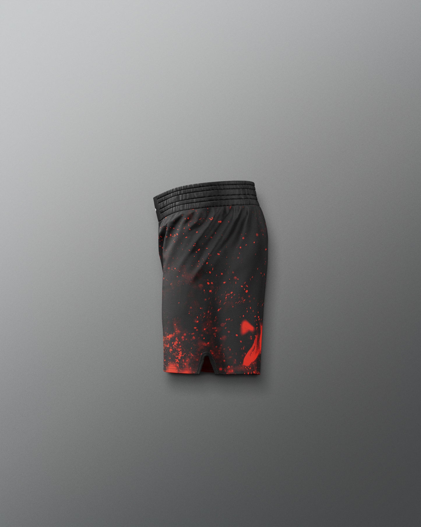 Black shorts with red splatter pattern on a gray background
