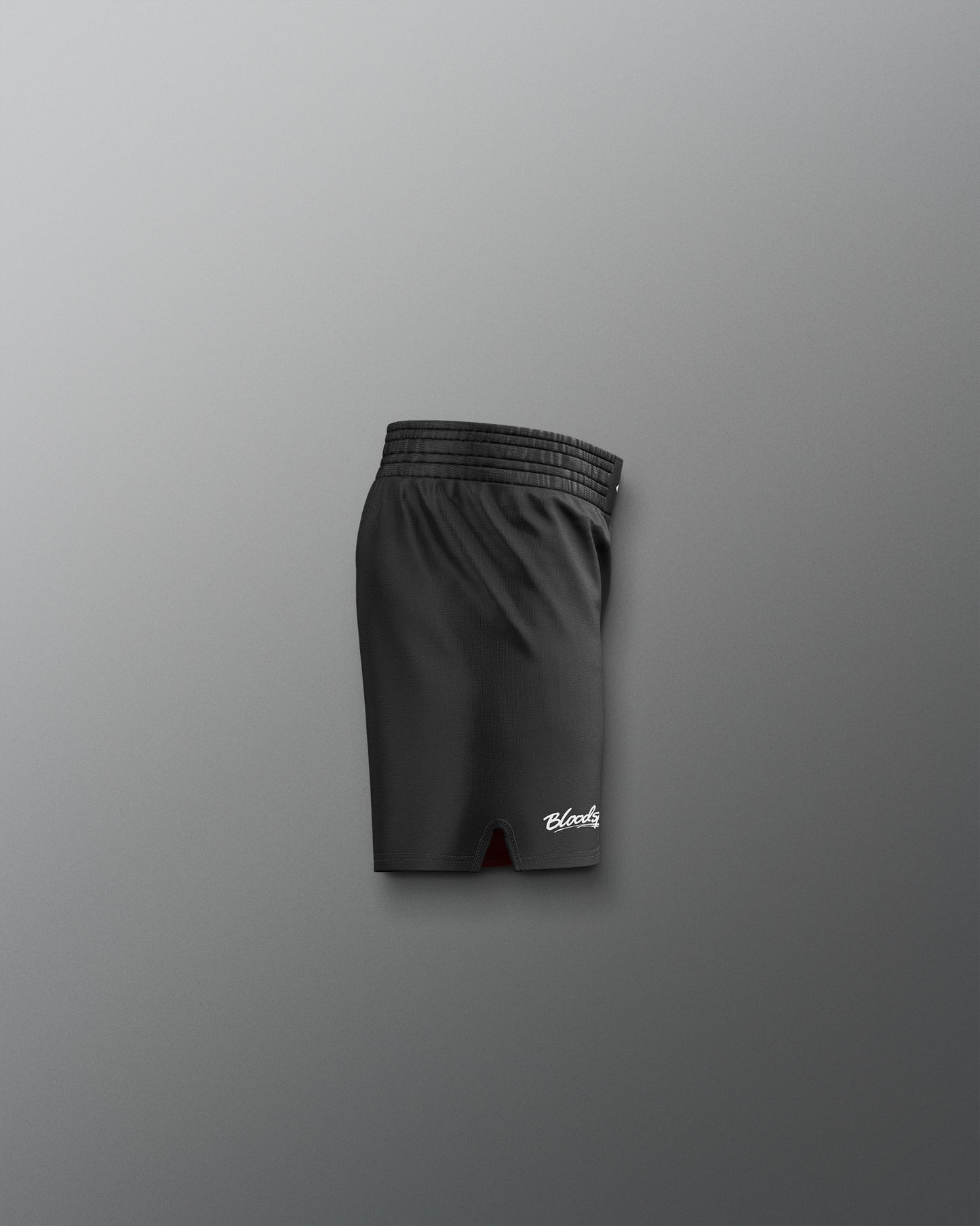 Black shorts with a brand logo on a gray background