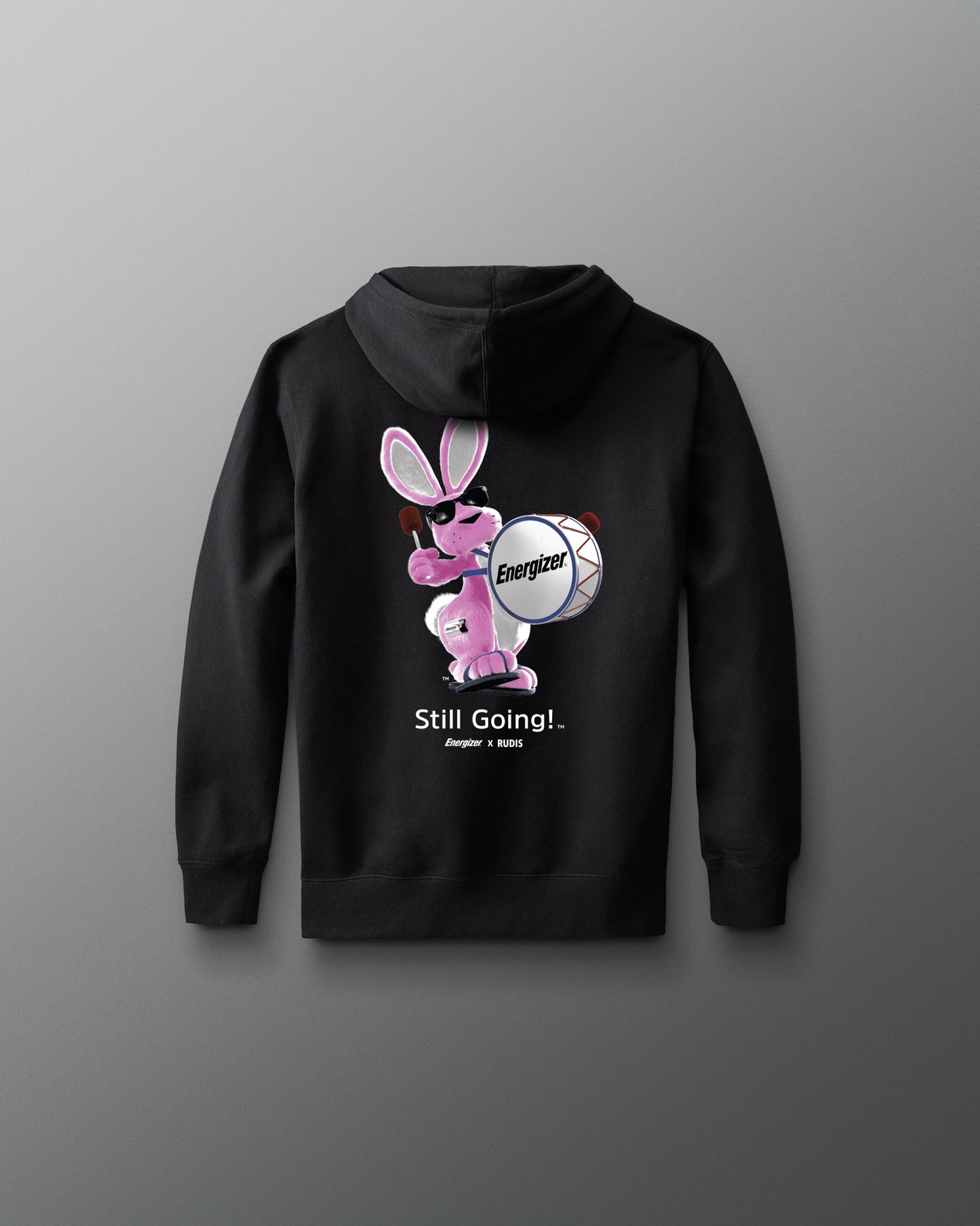Black hoodie with a cartoon character and text on the back against a gray background