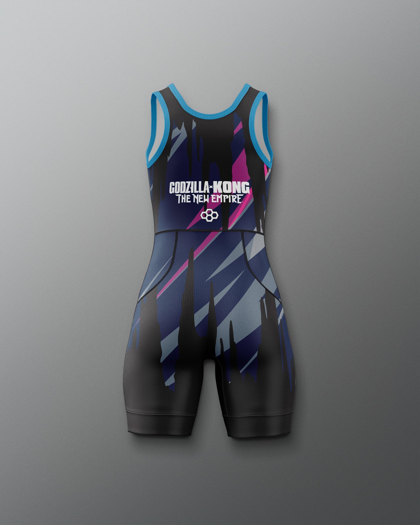A sleeveless athletic one-piece wrestling singlet with a black, blue, and purple geometric pattern, featuring the text 'GODZILLA-KONG THE NEW EMPIRE' on the chest, displayed against a neutral gray background.