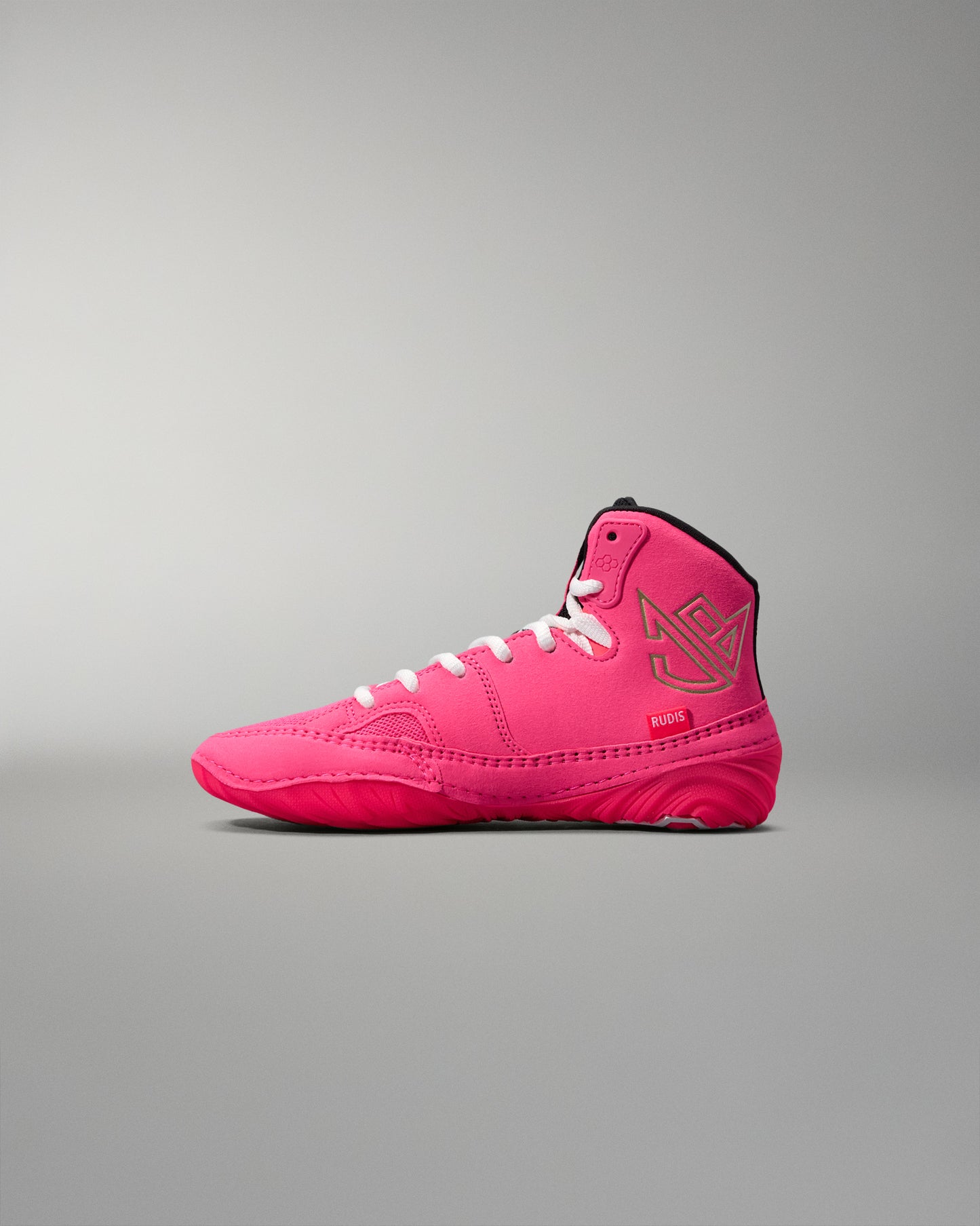 Pink high-top wrestling shoe on a gray background