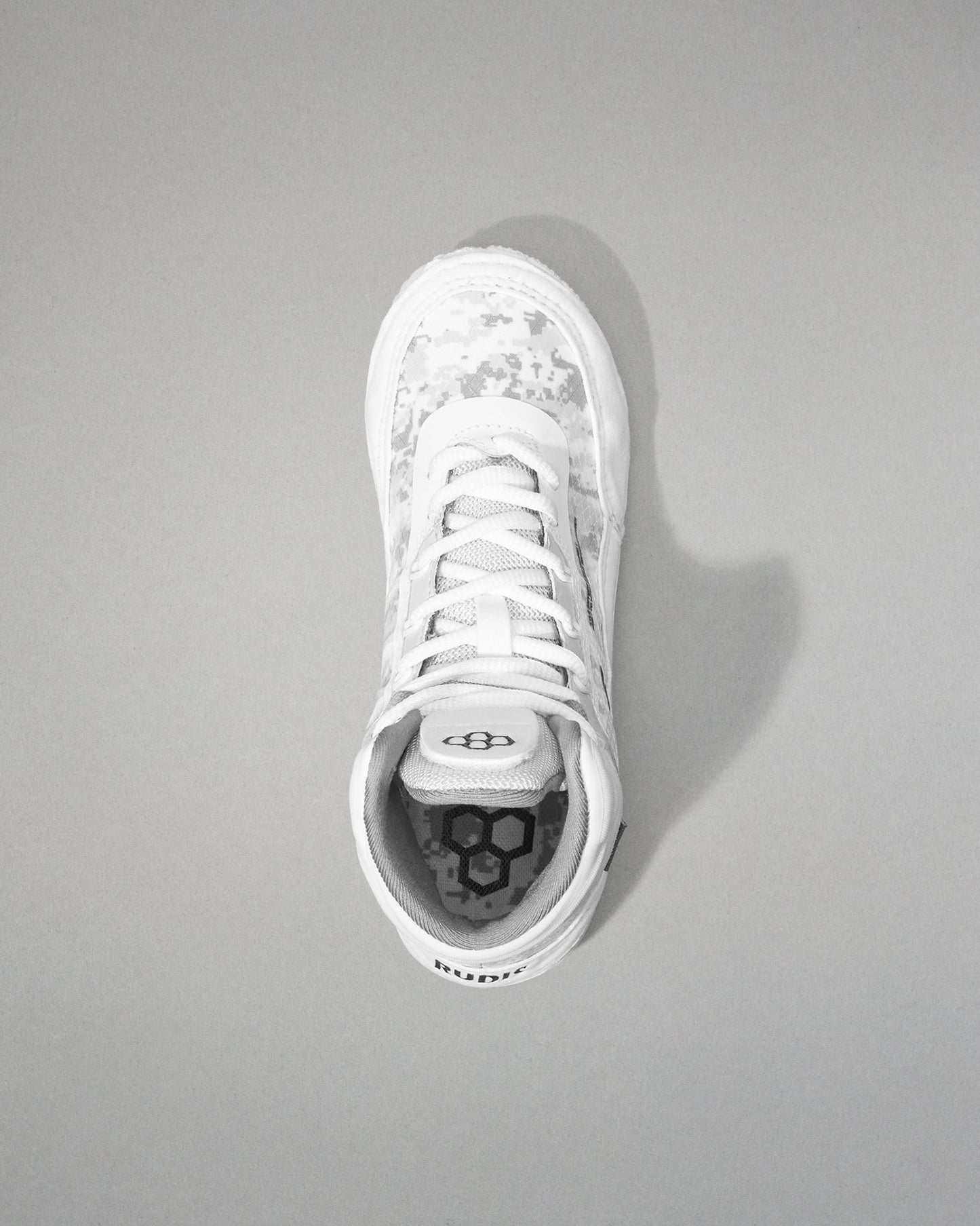 White wrestling shoe on a gray background
