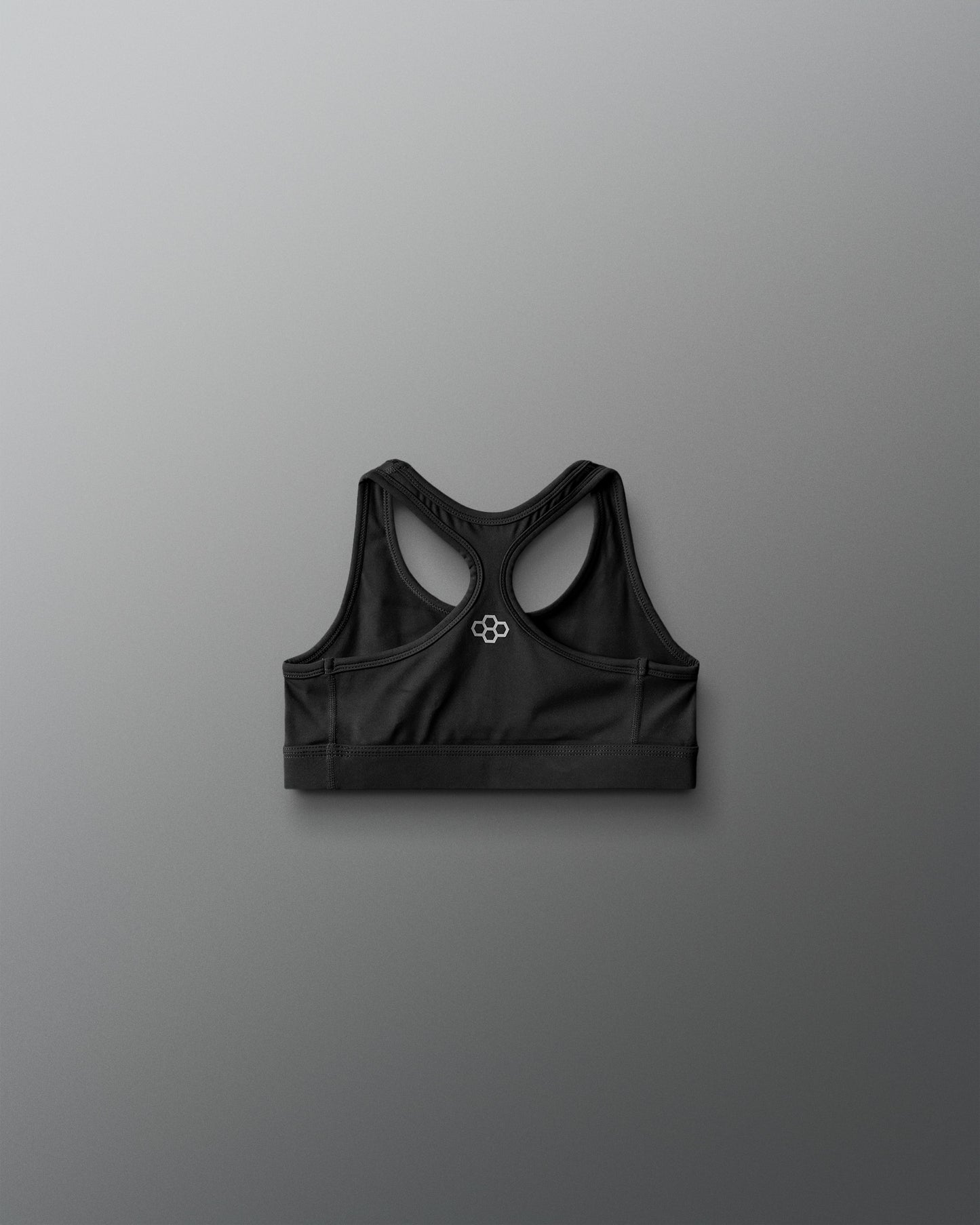Black sports bra on a gray background